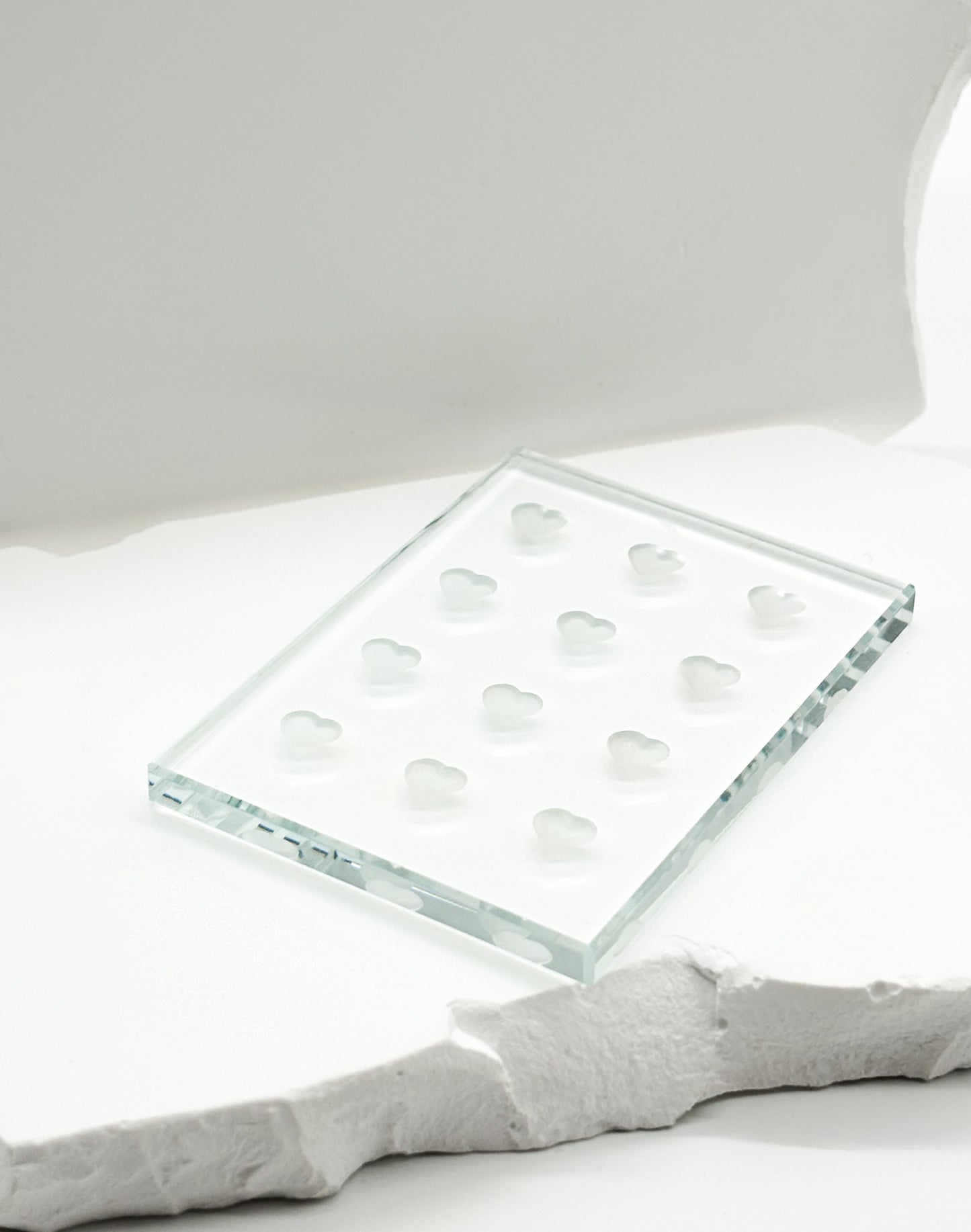 Adhesive tile for holding lash glue during eyelash extension application