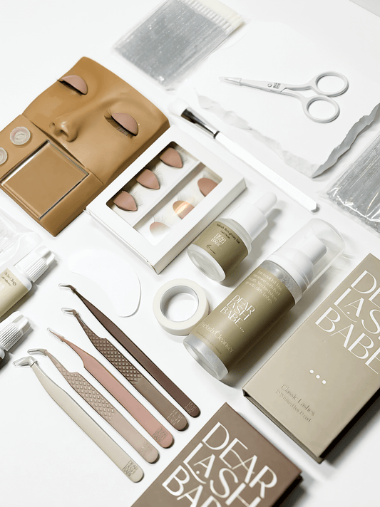 Eyelash Extension Professional Kit with lash tools, adhesives, practice pads, and application accessories.