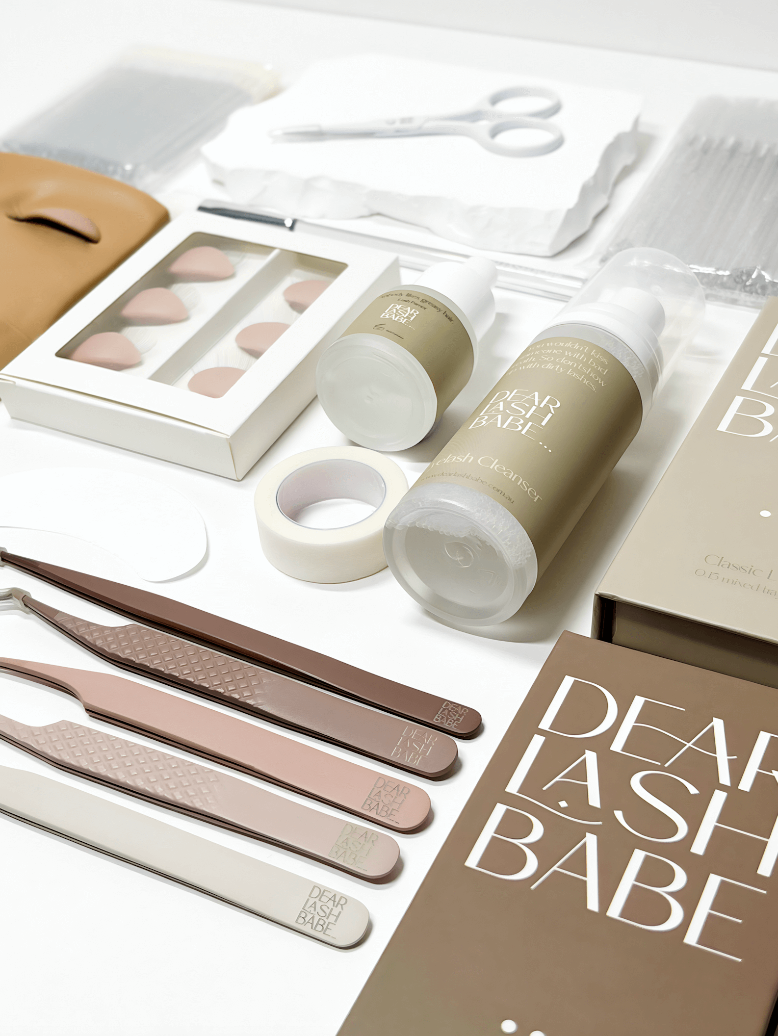 Eyelash Extension Professional Kit with tools and products for lash application and care on a white background.