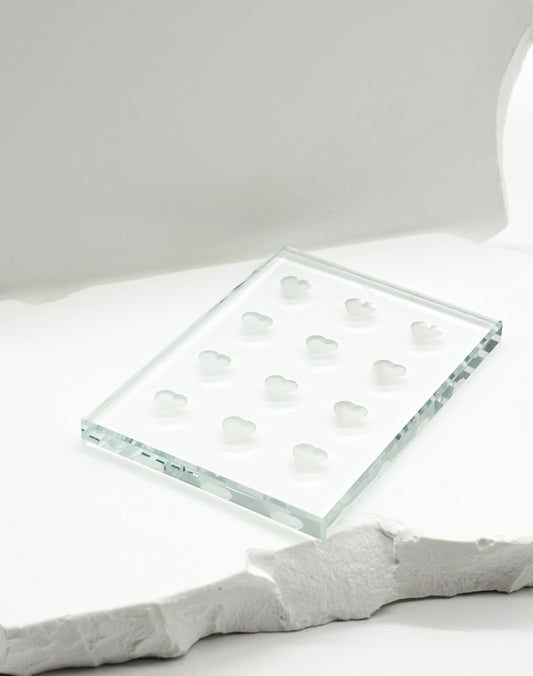Adhesive tile for holding lash glue during eyelash extension application