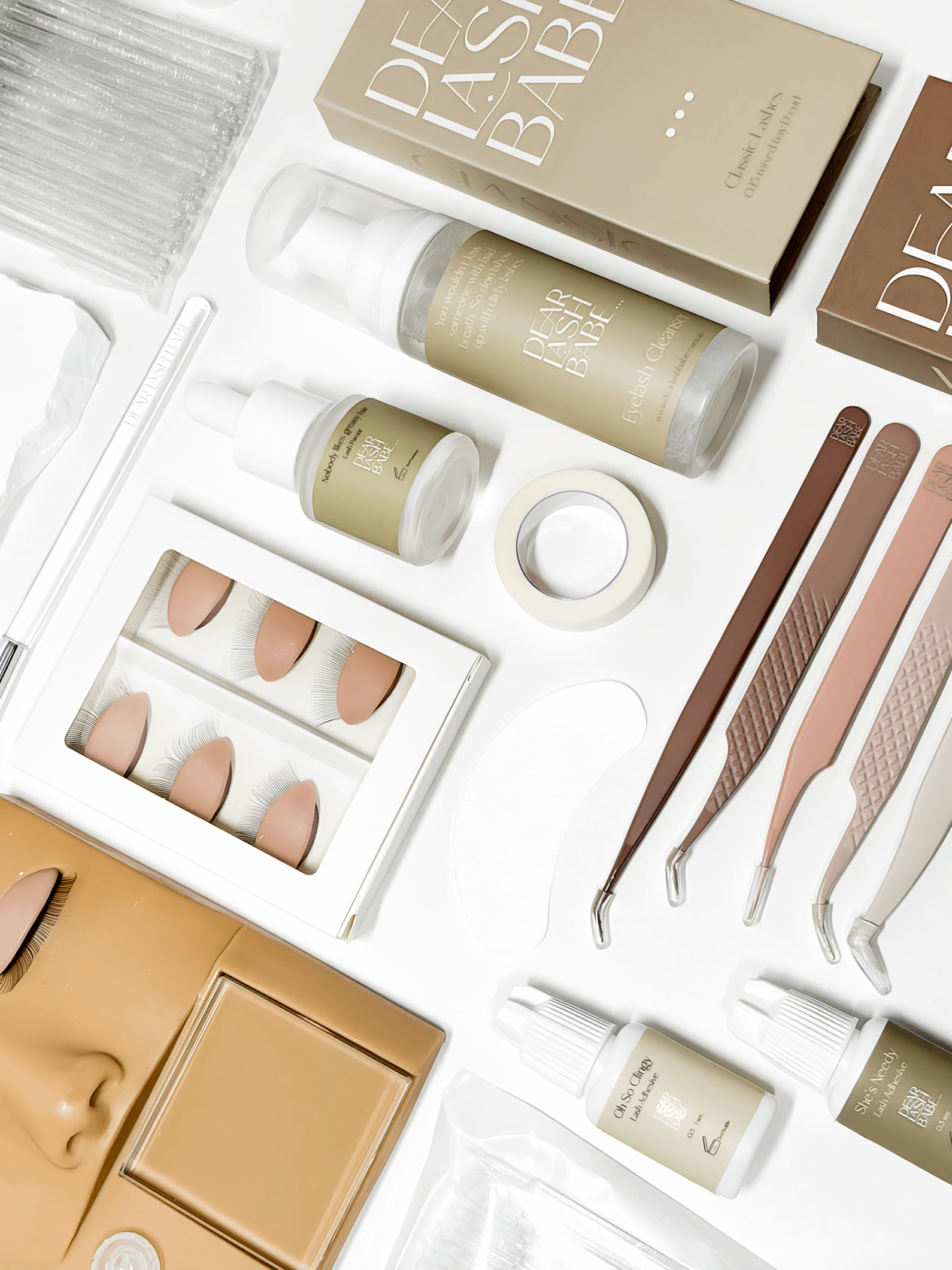 Eyelash Extension Professional Kit with lash tools, adhesives, and practice supplies for lash artists.