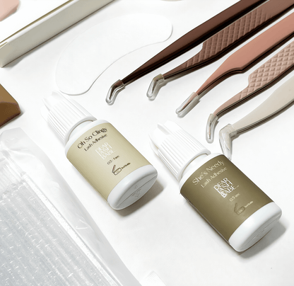 Eyelash Extension Professional Kit with lash adhesives and tools for lash application.
