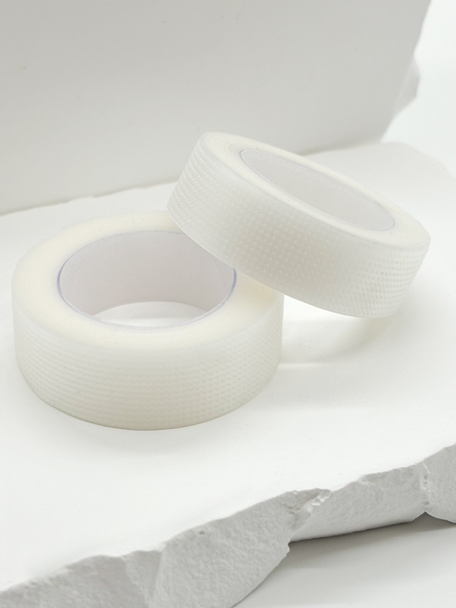 Disposable lash tape roll for eyelash extension services